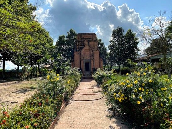 Two rows of flowers planted in front of the east main entrance of the tower