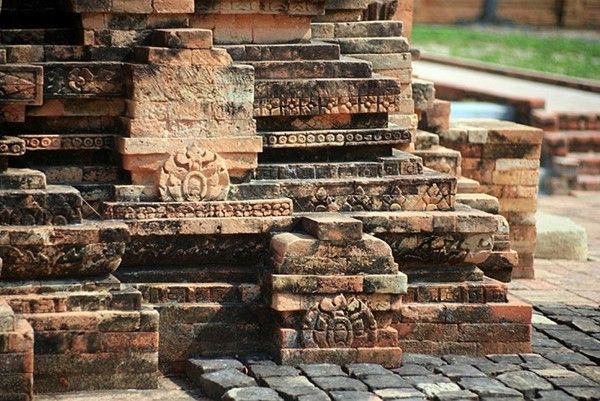 The neatly arranged fired bricks at the tower's base