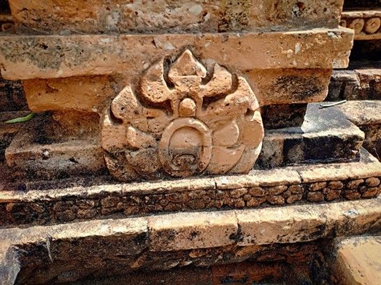 Close-up of lively patterns depicting a blooming flower or sacred flame